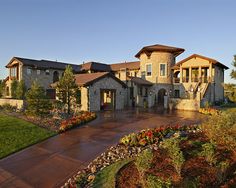 a large house with lots of landscaping around it