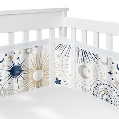 a white crib with stars and moon designs