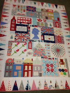 a quilt made to look like it is in the shape of a british cityscape