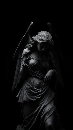 an angel statue is shown against a black background