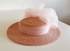 Handmade from tiny ribbons of straw and extremely lightweight, this unique Edwardian style hat is a perfect summer accessory both for formal and casual occasions. Available in old rose (as seen in the photos), red, fuchsia pink, cerise, jade green and royal blue. Diameter: cca 33cm Depth of the head part : cca 5 cm Summer Straw Hat With Ribbon For Spring, Short Brim Boater Hat With Ribbon For Garden Party, Chic Spring Straw Hat With Ribbon, Elegant Handmade Flat Brim Straw Hat, Kentucky Derby Boater Hat With Ribbon, Kentucky Derby Boater Hat With Ribbon For Garden Party, Elegant Woven Boater Hat For Kentucky Derby, Summer Party Hat With Ribbon, Elegant Woven Boater Hat For Spring