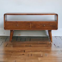 a wooden table with two drawers on it