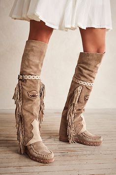 Italian made suede moccasin inspired boots featuring an over the knee fit, fringe trim and belted details.* Lace-up back* Padded insole Native American Boots, Handmade Moccasins, Boots Boho, Free People Boots, Boho Boots, Rodeo Outfits, Faux Suede Boots, Suede Moccasins, Moccasin Boots