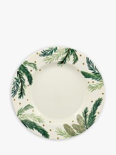 a white plate with green pine cones and leaves on the rim, against a white background