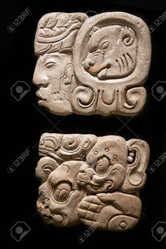 two ancient stone carvings on display at the archeological museum in cuzca, peru