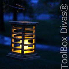 a lantern is lit up in the dark