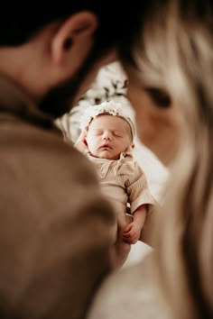 a woman holding a baby in her arms