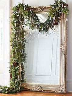 a large mirror sitting on top of a wooden floor