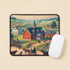 a computer mouse sitting on top of a wooden desk next to a painting of farm scenes