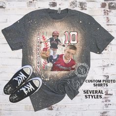 Bleach Distressed Sublimated Shirts - BASEBALL PERSONALIZED PHOTO SHIRTS FOR THE BASEBALL MOM, GRANDMA, SISTER OR AUNT - WE CAN EVEN MAKE THIS STYLISH FOR DAD TOO IN a Acid Wash Style! Having a supplier issue until March so some of these may come in Navy color which is almost identical to Charcoal. TO ORDER ------- 1. Choose your size 2. Choose the Style # (seen in the photos) 3. Send photos in a message to me after you place the order. Please keep a eye out for a message back from me so you can Custom Baseball Player Shirts, Sports Shirt With Team Name For Baseball Season, Crew Neck Sports Shirt For Baseball Season, Fan Apparel Shirt For Baseball Season, Baseball Season Sports Shirt With Crew Neck, Sporty Pre-shrunk Shirt For Baseball Season, Baseball Season Fan Apparel Shirt, Pre-shrunk Shirt For Baseball Season, Baseball Season Sports Fan Apparel Shirt