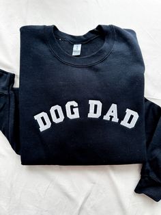 Details Who says there aren't ultimate dog dads out there too? Treat the dog dad in your life to this embroidered crew neck sweatshirt. This design is featured on a black Gildan unisex sweatshirt. Due to lighting and differences in monitors, actual colors may vary slightly from what appears online Model Info Nick is wearing a size large Materials 80% Cotton 20% Polyester Shipping Each Tails Up, Pup embroidered item is handmade to order & may have a processing time of up to 14 business days. If a Unisex Sweatshirt, Crew Neck Sweatshirt, Crew Neck, Sweatshirts, Dogs, How To Wear, Black