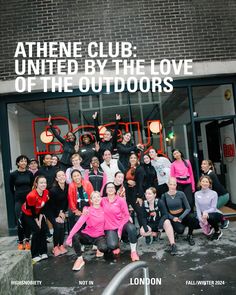 a group of people posing for a photo in front of a building with the words athene club united by the love of the outdoorss