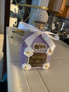 a small purple box with white flowers on it