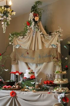 a table topped with lots of cakes and desserts