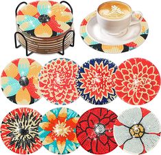 four coasters with different designs on them and a cup of coffee in the middle