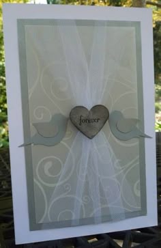 a white card with a heart on it