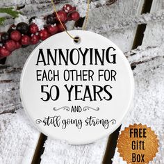 "Looking for the perfect 50th anniversary gift? Look no further than our Annoying Each Other For 50 Years Ornament! This unique ornament is sure to get your loved ones laughing and happy - perfect for any wedding, 50th anniversary, or golden anniversary. So don't wait - order your Annoying Each Other For 50 Years Ornament today! ❤️❤️ NEED A DIFFERENT YEAR? If you can not find the proper year in my shop, please message me and I will either help you find it or get it listed for you! ❤️❤️ An ornament is a perfect keepsake for years to come! The design is permanently printed on a flat round ceramic ornament which includes a gold ribbon string for hanging and white gift box secured with a stretchy silver loop. This makes for effortless gift giving! 🎄 Ornament measures: 2.625″ - 3″ 🎄 Design pr 40th Anniversary Gifts For Parents, 50 Years Anniversary Gift, Your Annoying, Second Anniversary Gift, 30th Anniversary Gifts, 20th Anniversary Gifts, 25th Anniversary Gift, Ruby Anniversary, Anniversary Ornament