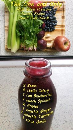 a jar filled with fruit and vegetables next to a cutting board