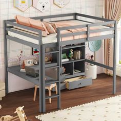 a loft bed with desk underneath it in a child's room