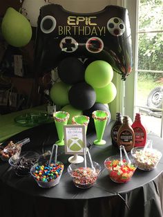 an image of a birthday party with balloons and candy buffet table set up for guests