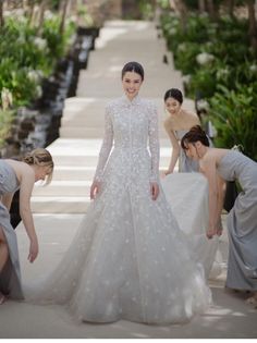 the bride is getting ready to walk down the aisle