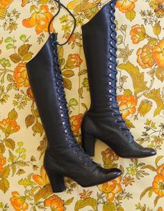 Out of this world vintage late 1960s leather gogo boots.  Made from a supple leather in a deep muted navy shade.  Tapered heel and lace up design with eyelets and hooks, original laces and leather soles.  Victoriana, medieval revival style evocative of the late 1960s era and psych scene.  Highly sought after and in excellent condition. LABEL: Paputsi of Greece FABRIC: Leather outer, leather interior (lined with fabric that appears to be man made) and leather soles. CONDITION: Great vintage condi 1960s Medieval Revival, Medieval Revival, Tooling Patterns, Old Fashion Dresses, Gogo Boots, Late 1960s, Navy Lace, Vintage Boots, Leather Logo