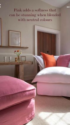 a pink couch and ottoman in a living room with a quote on the wall above it