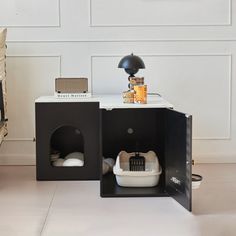 a small dog house in the corner of a room