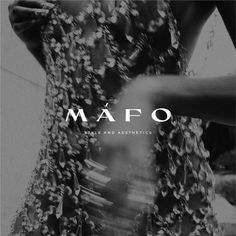 a black and white photo of a woman with her hands on her hips in front of the words mafo