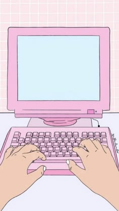 a person typing on a pink laptop computer with their hands resting on the keyboard and mouse