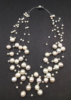 "A gorgeous piece multi strand floating pearls necklace there are 6 strand baroque pearl beautiful combination with nice magnetic clasp perfect for any occasions measures 16\" - 20\" length and total weight of 87.8 grams." Multi-strand Pearl Drop Necklace, Multi-strand Pearl Necklace With Pearl Charm, White Multi-strand Pearl Necklace, Floating Pearl Necklace, Multi Strand Pearl Necklace, Bezel Necklace, Black Onyx Necklace, Pearls Necklace, Onyx Necklace