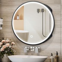 a bathroom with a round mirror above the sink