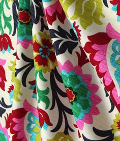 the fabric is colorful and has flowers on it