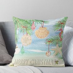 a christmas card with seashells and starfish hanging from the tree throw pillow