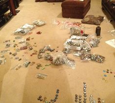 a living room filled with lots of different types of buttons and pins on the floor