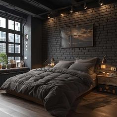 a large bed sitting next to a window in a room with wooden floors and brick walls