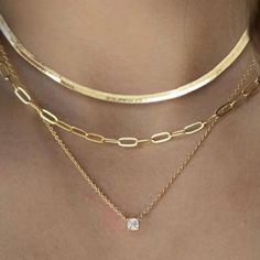 Experience luxury with our Layered Gold Necklaces set for women. This 3-piece 14K Vermeil Gold/Silver set includes a 16-inch clavicle herringbone necklace, a 17-inch paperclip style necklace, and an 18-inch necklace with a 1 carat total weight of flawless princess cut cubic zirconia pendant. These versatile pieces can be worn together as a layered style or separately to complement any outfit. Perfect for any occasion, this set makes a stunning gift for someone special. Don't miss out on the chan 3 Piece Necklace Set, Gold Cubic Zirconia Jewelry Sets With Clavicle Chain, Silver Gold-plated Diamond Cut Jewelry, Silver Diamond Necklace Tarnish Resistant, Elegant Jewelry Sets With Adjustable Chain, Silver Diamond Necklace With Delicate Gold-plated Chain, Silver Diamond Cut Necklace Gold Plated, Elegant Silver Herringbone Necklace With Adjustable Chain, Elegant Herringbone Necklace With Delicate Chain As Gift