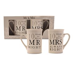 three coffee mugs with the words mr and mrs printed on them in front of a box