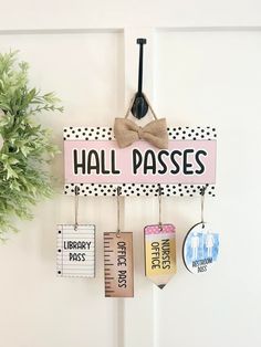 there is a sign that says hall passes hanging on the door