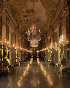 an ornate hallway with chandeliers and mirrors