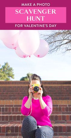 a woman sitting on the steps taking pictures with her camera and balloons in front of her