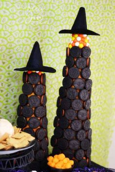 two halloween candy towers with witches hats on them