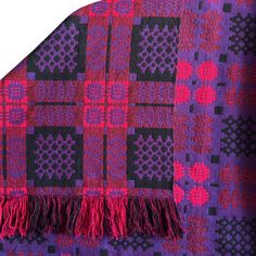 a purple and black plaid blanket with fringes