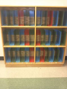 a wooden bookcase filled with lots of books