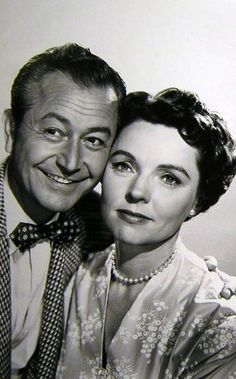 an old black and white photo of two people