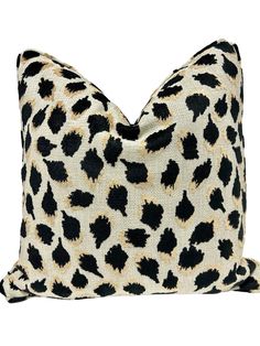 a black and white leopard print pillow on a white background