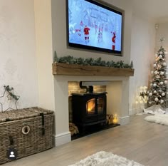 a living room filled with furniture and a flat screen tv mounted above a fire place