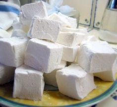 a pile of white marshmallows sitting on top of a counter