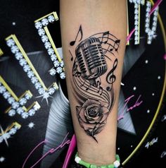 a black and white photo of a microphone with music notes on it's arm