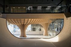 an indoor skate park with curved wooden structures